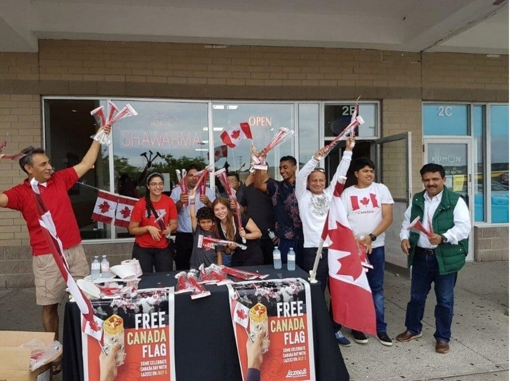 Lazeez Canada Day Celebration with a group of people